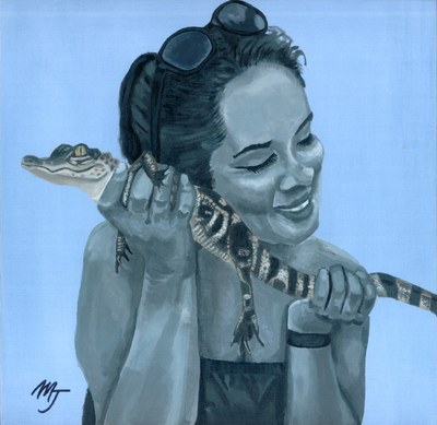 A smiling woman in greyscale holding a small alligator across her hands, against a pale blue ground