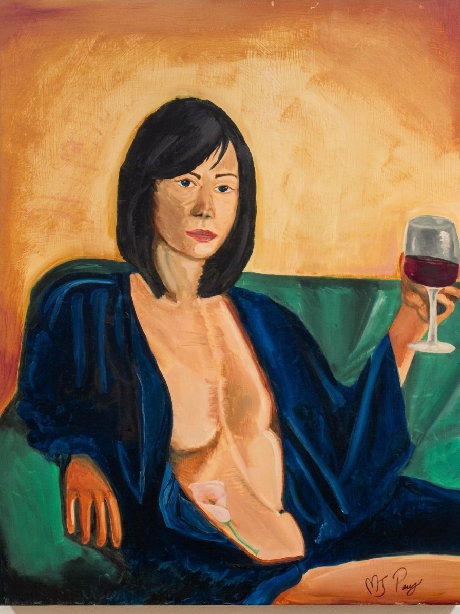 A woman with dark bobbed hair sits on a green sofa in an open dark blue robe, a glass of red wine raised in one hand, a pale flower resting at her chest, against a warm ochre wall