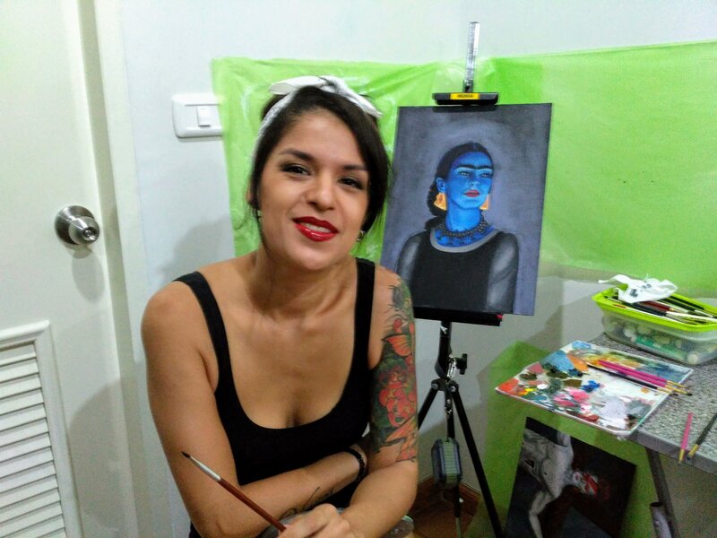 Mariajuanita Guzman painting in her studio